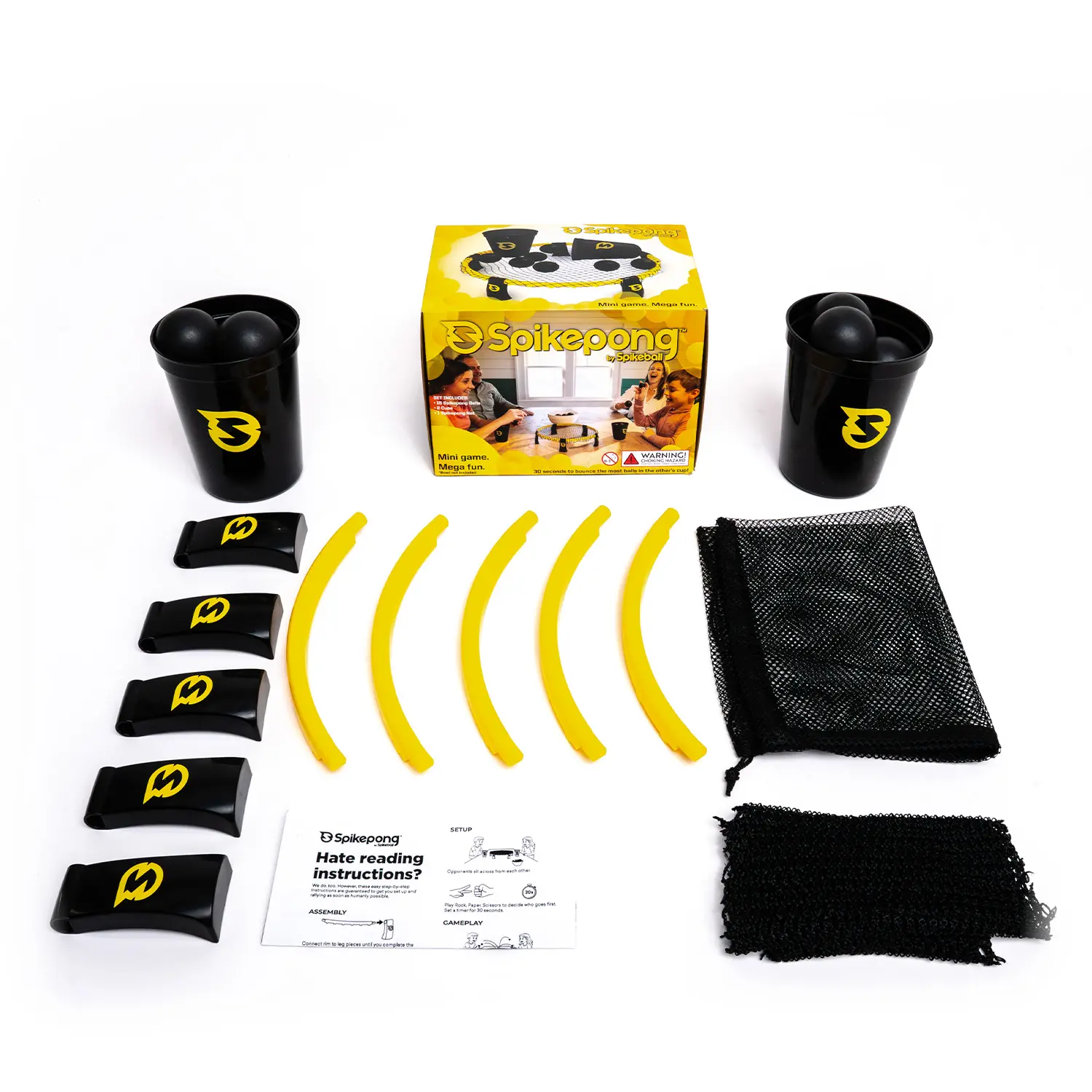 Spikepong Spielset von Spikeball mit zwei schwarzen Bechern, sechs schwarzen Bällen, gelben Rahmenstücken, schwarzen Standfüßen, Netz, Tasche, Anleitung und Verpackung – vollständiges Indoor‑ und Outdoor‑Teamspiel für Freizeit und Familie